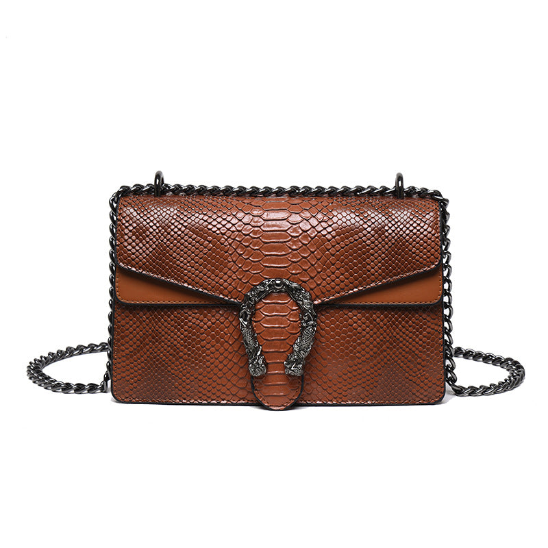 Maison Maryim Croc-Embossed Evening Bag — close-up detail — evening bag