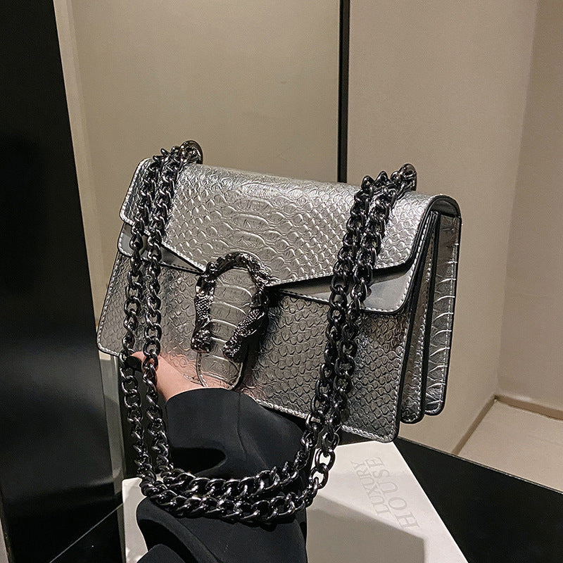 Maison Maryim Croc-Embossed Evening Bag — close-up detail — evening bag