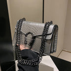 Maison Maryim Croc-Embossed Evening Bag — close-up detail — evening bag