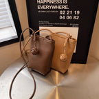 Maison Maryim Pendant Mini Crossbody — vegan leather mini bag with signature ball-pendant charm, Mélange collection