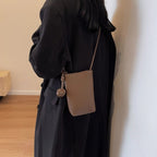 Maison Maryim Pendant Mini Crossbody — vegan leather mini bag with signature ball-pendant charm, Mélange collection